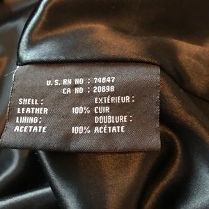 Mid length Marc New York black leather coat.